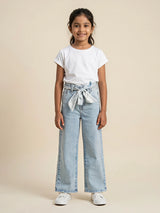 Young girl wearing light blue wide leg casual pants with waist belt tie-up and side pockets paired with a white t-shirt and sneakers