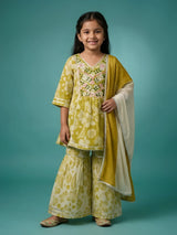 Young girl wearing an olive green floral printed sharara suit with embroidered V-neckline and matching dupatta