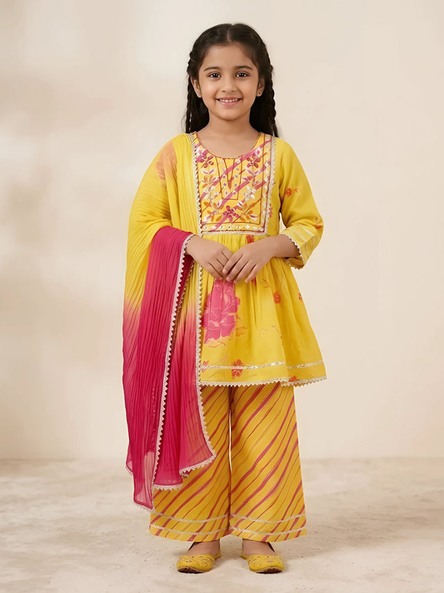 Vibrant yellow floral printed kurta pajama set for girls with ombre pink and yellow dupatta.
