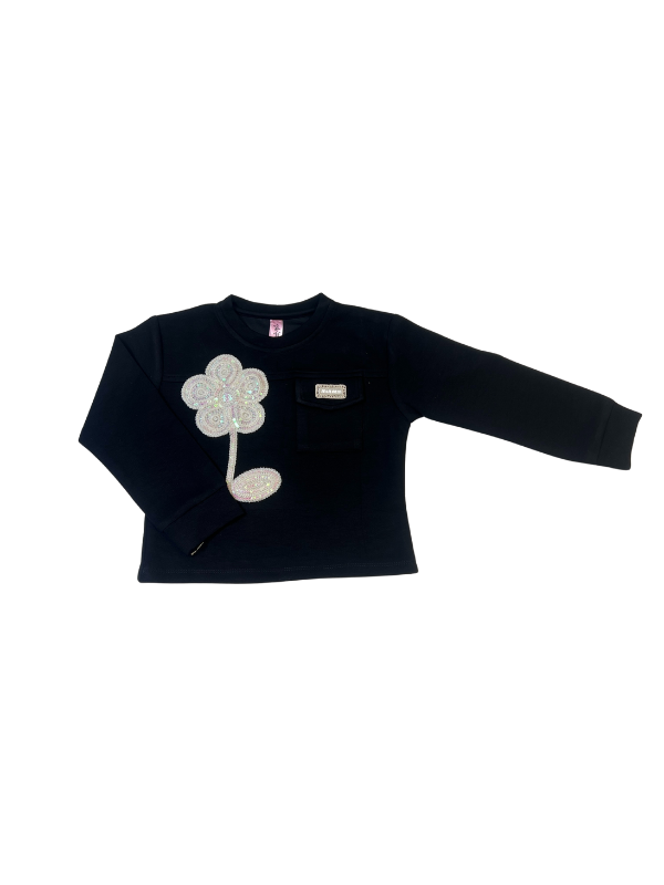 Girls' long-sleeved black top with a large, sparkly flower appliqué made of rhinestones or pearls on the chest.

Export to Sheets