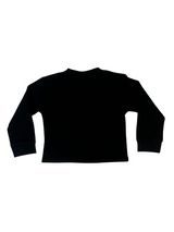 Girls' long-sleeved black top with a large, sparkly flower appliqué made of rhinestones or pearls on the chest.

Export to Sheets