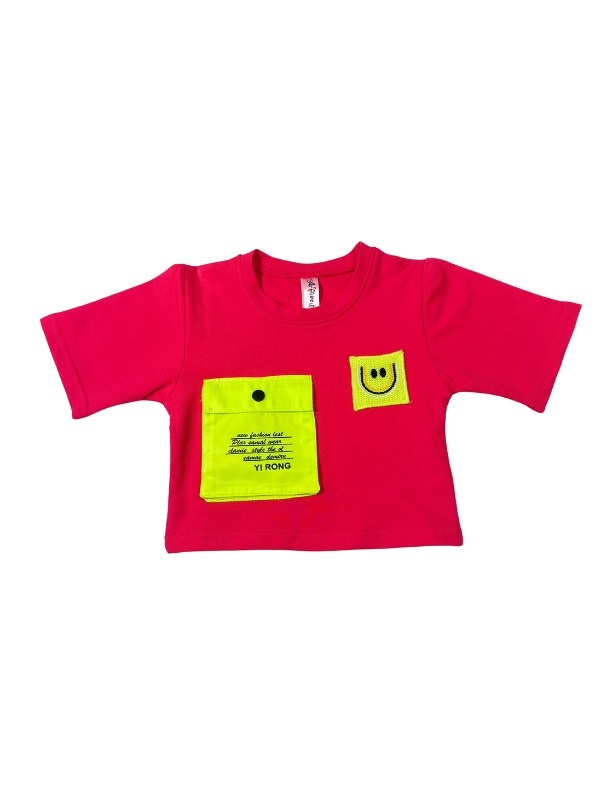 Girls' short-sleeve rani pink (magenta) crop top with a neon yellow square pocket and a neon yellow patch featuring a black embroidered smiley face.

Export to Sheets