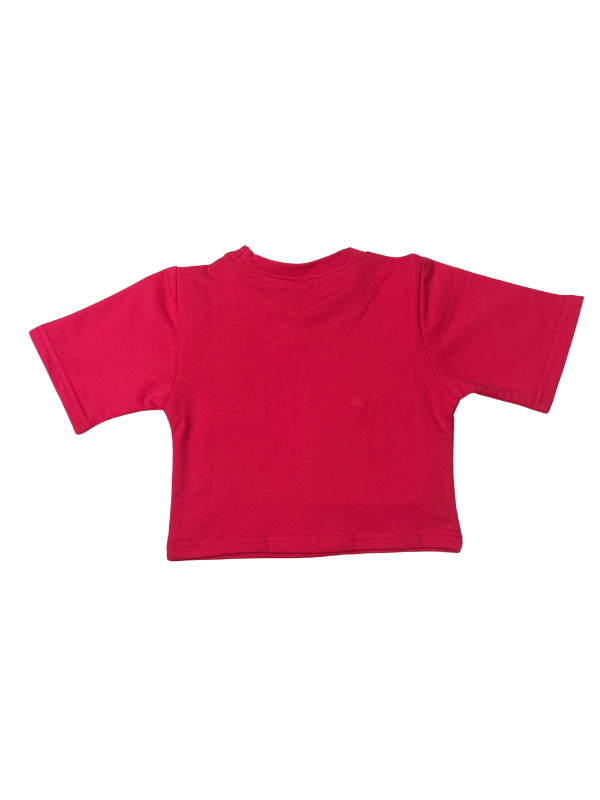 Girls' short-sleeve rani pink (magenta) crop top with a neon yellow square pocket and a neon yellow patch featuring a black embroidered smiley face.

Export to Sheets