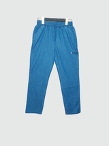 Medium blue boys' casual drawstring pants in a denim-look fabric, featuring an elastic waist and a small horizontal zipper detail on the hip.