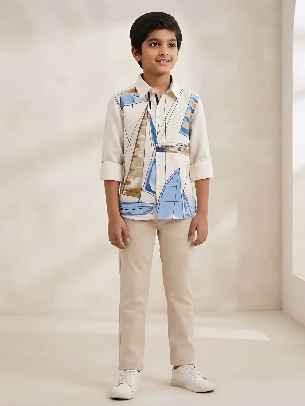 Boys wearing a cream full sleeve casual shirt featuring a sailboat print and button-down front