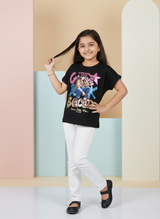 Girls' Black Long-Sleeve Top with Colorful Patchwork Flower.