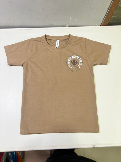 Tan/Brown boys' short-sleeve T-shirt with a small circular distressed cross and text logo graphic on the left chest, hanging on a white background.