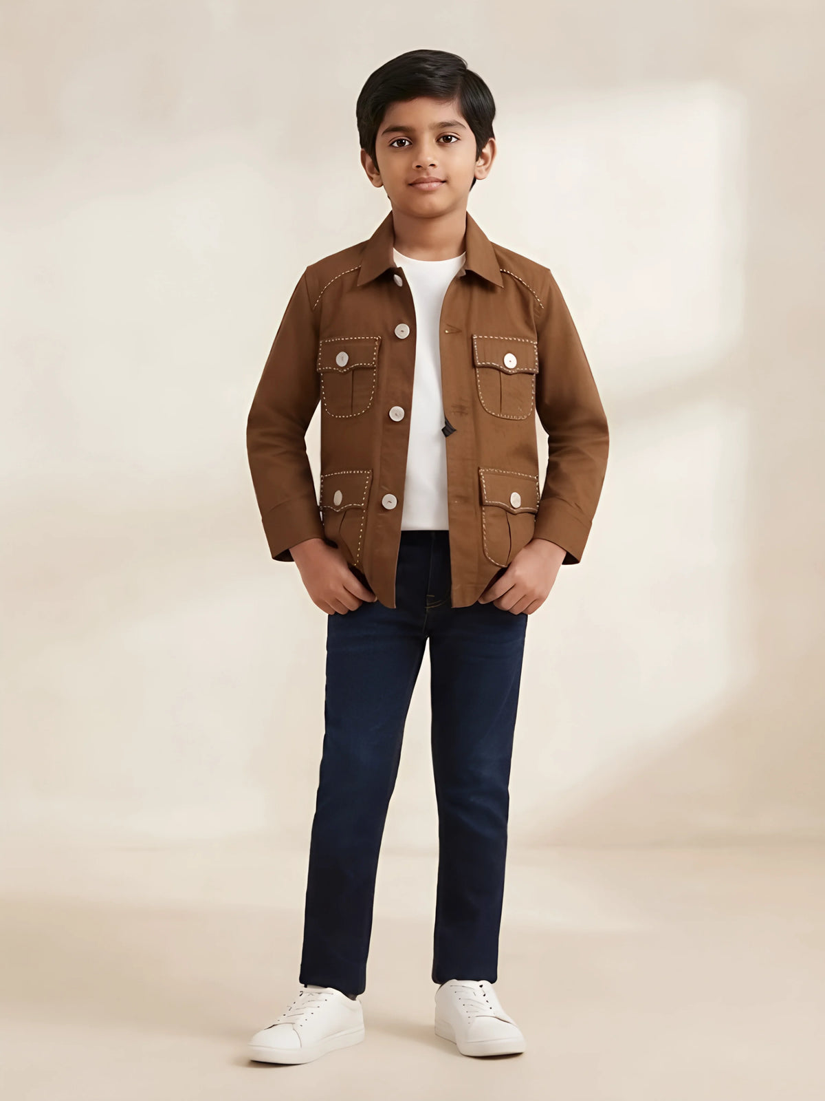 Boy wearing a brown full sleeve casual shirt with front flap pockets and contrast stitching