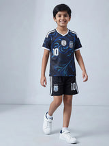 Young boy wearing a navy blue graphic football sports co-ord set with number 10 print and matching shorts