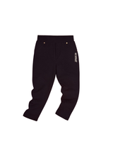 Pair of solid black girls' casual pants/jeggings with an elastic waistband and small gold stud details near the faux front pockets, featuring a white vertical logo embroidery on the hip.