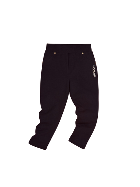 Pair of solid black girls' casual pants/jeggings with an elastic waistband and small gold stud details near the faux front pockets, featuring a white vertical logo embroidery on the hip.