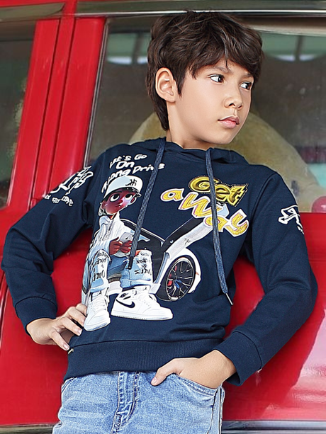 Young boy wearing a navy blue hooded sweatshirt with a large, colorful urban graphic print and lettering, including a drawstring hood and long sleeves.