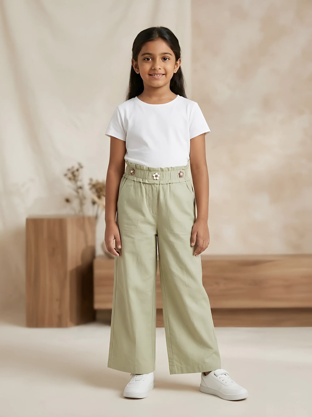 Young girl wearing stylish sage green high-waist wide-leg casual pants with side pockets and a white t-shirt.