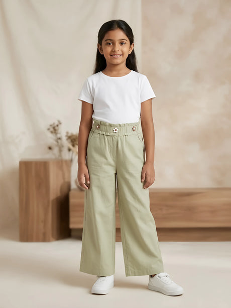 Young girl wearing stylish sage green high-waist wide-leg casual pants with side pockets and a white t-shirt.