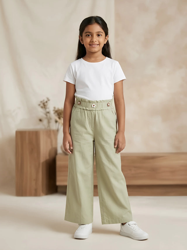 Young girl wearing stylish sage green high-waist wide-leg casual pants with side pockets and a white t-shirt.