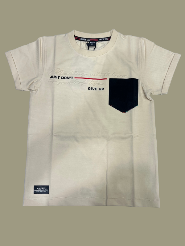 Cream/Beige boys' short-sleeve T-shirt with subtle horizontal texture, featuring the motivational text "JUST DON'T GIVE UP" and a solid black patch pocket on the chest