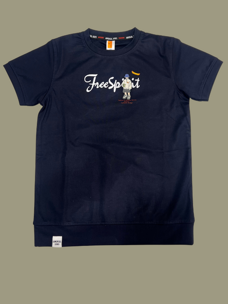 Dark Navy Blue boys' short-sleeve T-shirt with a white "Free Spirit" script and a small cartoon graphic of a backpacker figure, with a band detail at the bottom hem