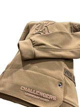 Neon lime green boys' short-sleeve T-shirt with a large, stylized metallic and white "TAZ-MANIA" graphic on the chest.