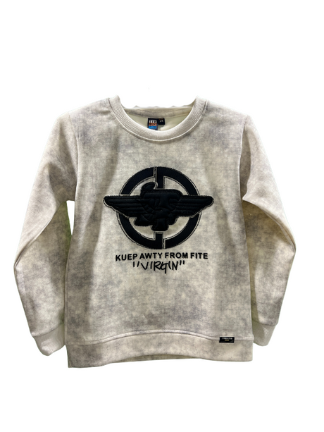 Cream/off-white boys' short-sleeve T-shirt with subtle horizontal ribbing, featuring a large navy blue patch with the word "PROUD" in multi-colored letters, and "DON'T STOP UNTIL YOU'RE" written above it