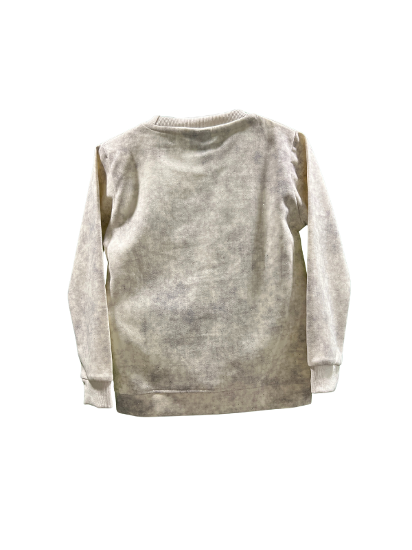 Cream/off-white boys' short-sleeve T-shirt with subtle horizontal ribbing, featuring a large navy blue patch with the word "PROUD" in multi-colored letters, and "DON'T STOP UNTIL YOU'RE" written above it