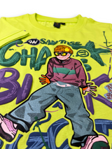 Boys' bright neon green short-sleeve t-shirt featuring a colorful graphic of a character wearing a cap and glasses, surrounded by purple and blue graffiti text and paint splatters.

Export to Sheets