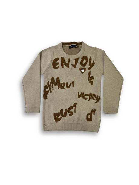 Boys' light brown knit sweater with long sleeves and large, brown, graffiti-style words and slogans printed across the front.

Export to Sheets