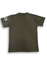 Boys' dark olive green short-sleeve t-shirt featuring a large, colorful, graffiti-style graphic of a boy performing a trick on a skateboard.

Export to Sheets