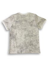 Boys' cream/white washed-texture t-shirt with a solid beige side panel and a black zipper utility pocket, with the black text "YES!" on the chest.

Export to Sheets