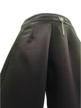 Girls' black wide-leg or palazzo-style trousers with a gold zipper accent at the waist and a delicate metallic gold glitter stripe down the outside seam of both legs.

Export to Sheets