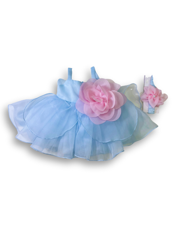 Girls' sleeveless light blue tiered tulle dress with a large, sheer pink flower appliqué on the chest and delicate shoulder straps.

Export to Sheets