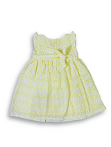 Bright yellow girls' dress with white floral eyelet embroidery, a wide embroidered border at the hem, and small ruffle cap sleeves.

Export to Sheets