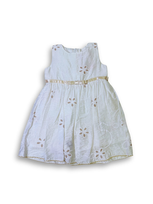Cream girls' frock with spaghetti straps, a multi-colored crochet or patchwork upper bodice, and embroidered flowers on the skirt.

Export to Sheets