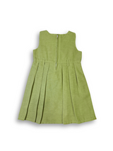 Girls' green pleated sleeveless dress paired with a detachable, short-sleeved bolero jacket featuring a light pastel fan-like print.

Export to Sheets