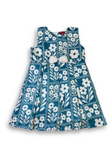 Girls' two-piece outfit featuring a teal and white oversized floral print dress with a detachable, cream-colored textured bolero jacket with a collar.

Export to Sheets