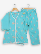 Girls' two-piece ethnic set consisting of an aqua blue kurta tunic and matching trousers, both decorated with small floral embroidery and white lace trim.
