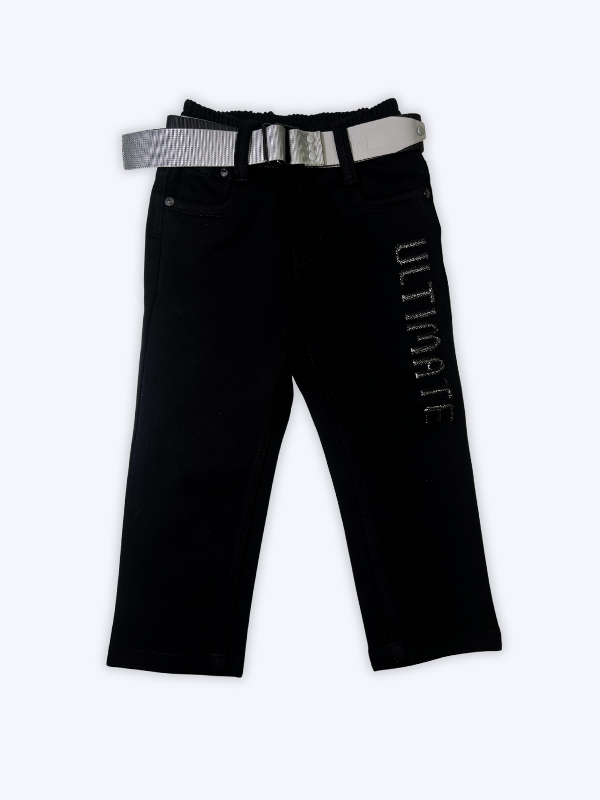 Boys' black straight-fit pants with the word 'ULTIMATE' printed/embroidered on the side, shown with an included silver-buckle belt against a white background.