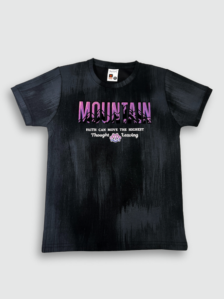 Black boys' short-sleeve T-shirt with a textured, blackout finish, featuring the word "MOUNTAIN" in a pink/purple gradient and a small motivational quote below