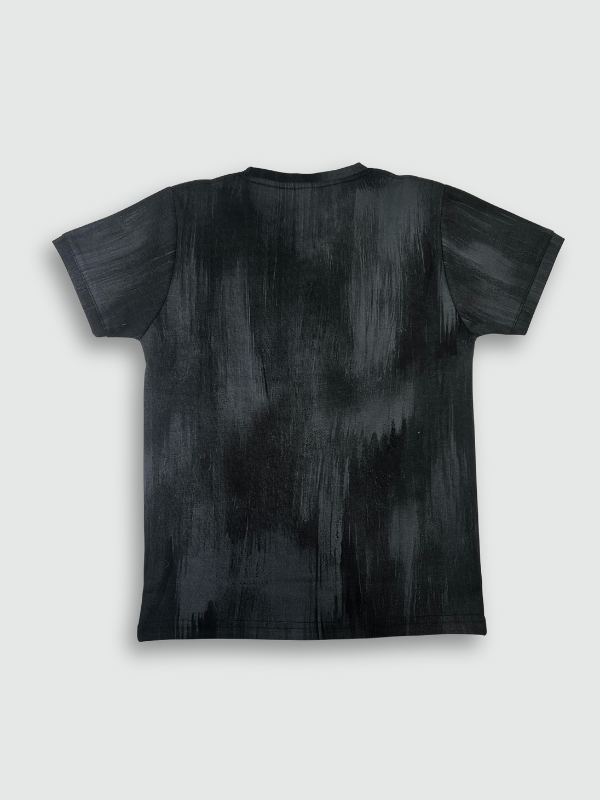 Black boys' short-sleeve T-shirt with a textured, blackout finish, featuring the word "MOUNTAIN" in a pink/purple gradient and a small motivational quote below