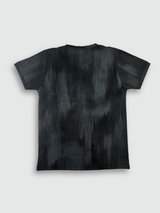 Black boys' short-sleeve T-shirt with a textured, blackout finish, featuring the word "MOUNTAIN" in a pink/purple gradient and a small motivational quote below