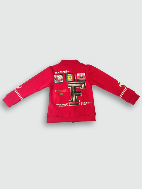 Bright red boys' zip-up jacket with black piping and gold horse emblems on the sleeves, styled over a black graphic T-shirt