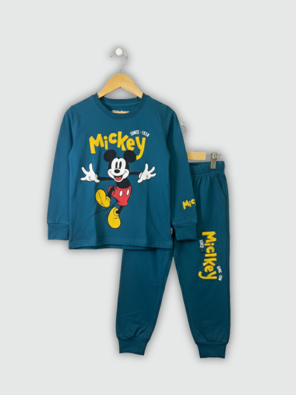 Two-piece boys' long-sleeve night suit in deep teal blue, featuring a large yellow "Mickey" graphic of the Disney character on the top and a matching logo print on the jogger pants