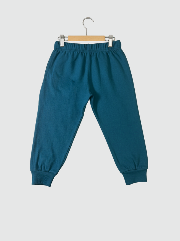 Two-piece boys' long-sleeve night suit in deep teal blue, featuring a large yellow "Mickey" graphic of the Disney character on the top and a matching logo print on the jogger pants