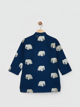 Boys' navy blue full-sleeve kurta with an all-over, repeating metallic silver elephant print, shown hanging on a hook. The ethnic top is suitable for festive occasions