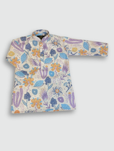 Boys' full-sleeve cream/off-white kurta with an all-over multi-color abstract floral print in purple, blue, and orange, paired with solid white straight-fit pajama bottoms. The ethnic set is shown hanging on a wooden hanger