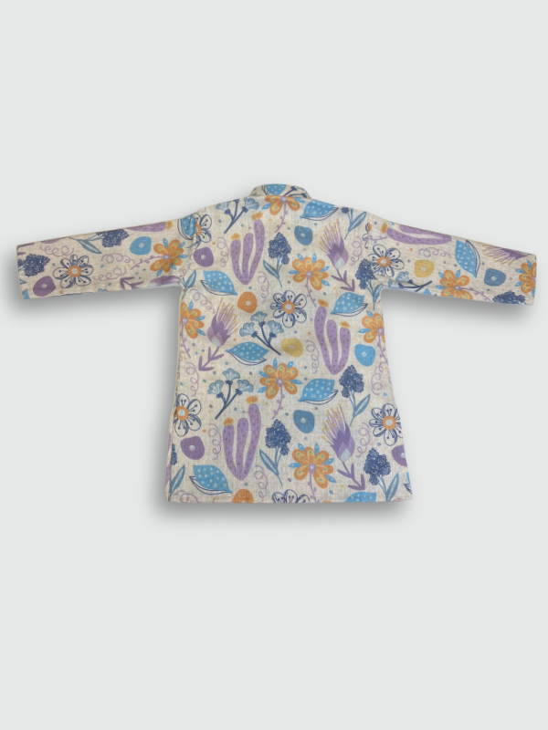 Boys' full-sleeve cream/off-white kurta with an all-over multi-color abstract floral print in purple, blue, and orange, paired with solid white straight-fit pajama bottoms. The ethnic set is shown hanging on a wooden hanger