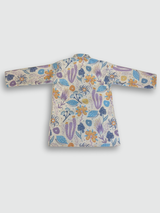Boys' full-sleeve cream/off-white kurta with an all-over multi-color abstract floral print in purple, blue, and orange, paired with solid white straight-fit pajama bottoms. The ethnic set is shown hanging on a wooden hanger