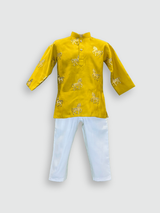 Boys' bright Haldi yellow full-sleeve kurta featuring a repeating gold embroidered horse motif, paired with solid white straight-fit pajama bottoms. The ethnic set is shown against a plain background