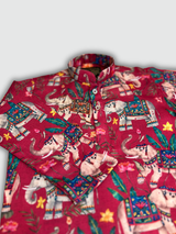 Boys' full-sleeve kurta in a deep Rani Pink/Red color, featuring a vibrant, all-over print of colorful, ornate elephants and tropical flowers. The traditional Indian ethnic topwear is shown on a mannequin