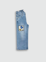 Light blue wash children's wide-leg denim jeans with large square cartoon character patches (including Road Runner and Bugs Bunny) on the front of the legs