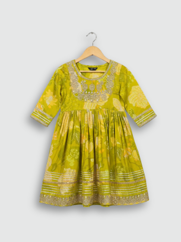 Full set laid flat: lime green kurta with gold embroidery and a floral print, matching tiered sharara pants, and a coordinating dupatta with green tassels.